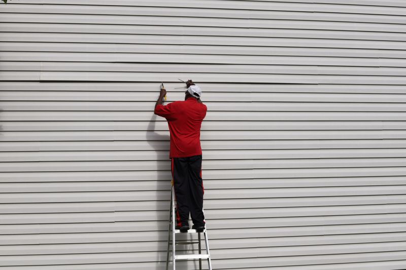 Professional Siding Repair Crew